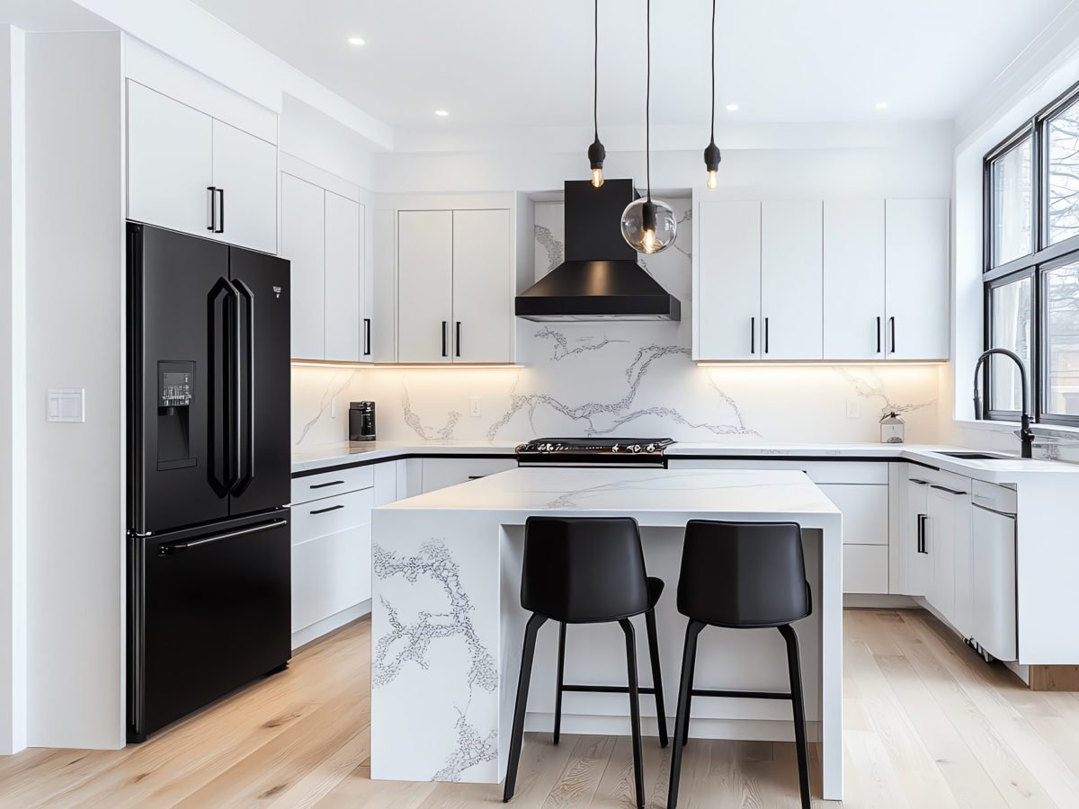 modern-white-kitchen-with-black-accents-large-window-marble-countertop-scaled.jpeg